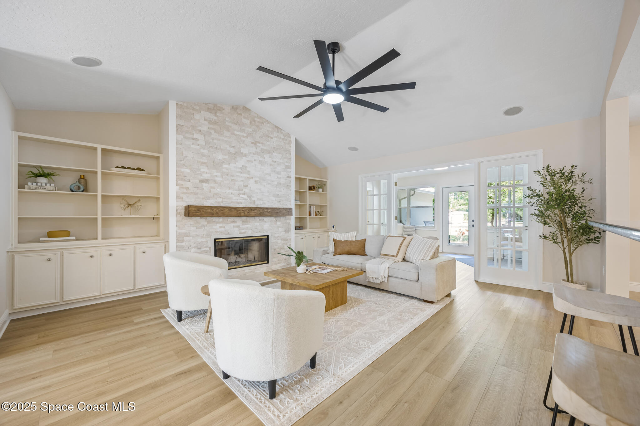 2190 Winston Drive Cocoa, FL 32926 - Photo 6 of 59 a living room with furniture a fireplace and a potted plant