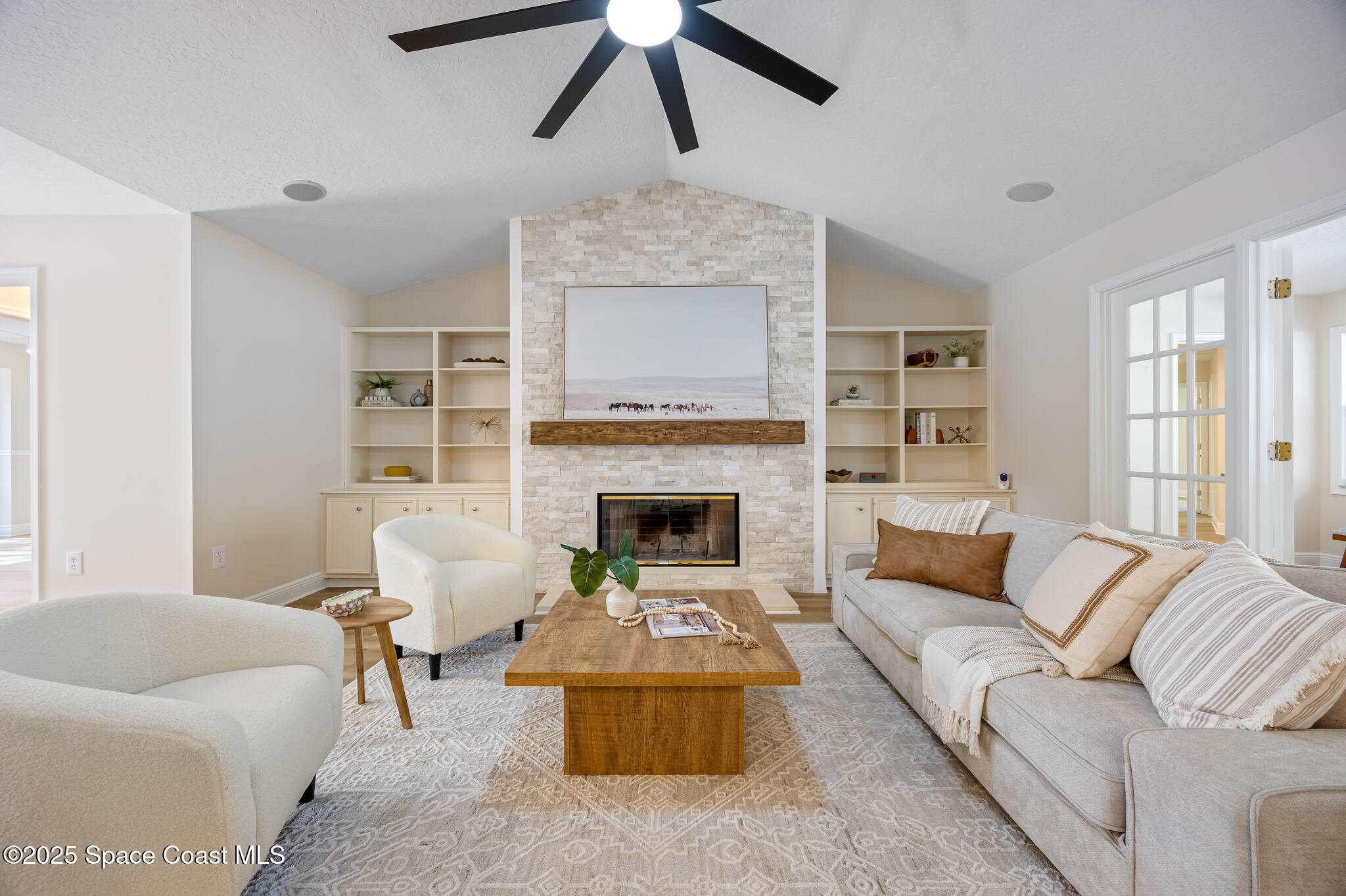 2190 Winston Drive Cocoa, FL 32926 - Photo 7 of 59 a living room with furniture and a fireplace