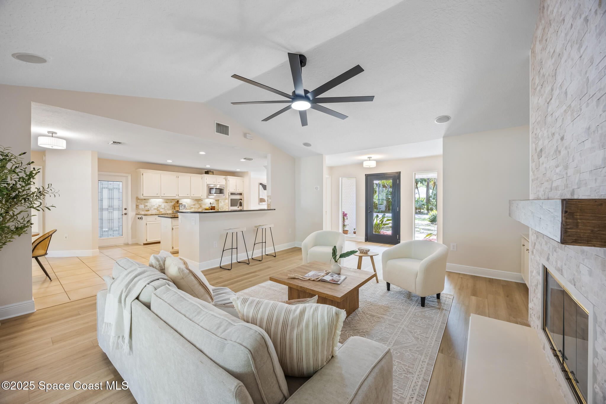 2190 Winston Drive Cocoa, FL 32926 - Photo 9 of 59 a living room with furniture and a fireplace
