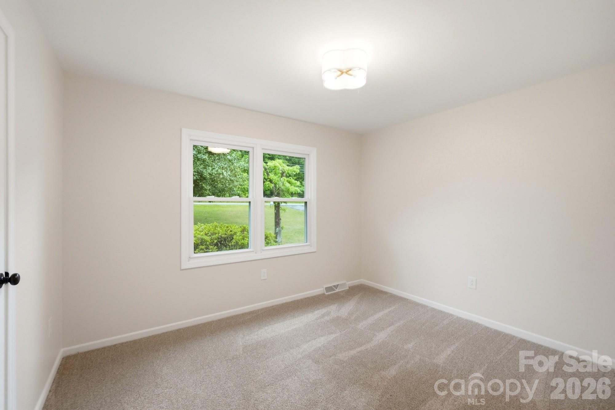 1235 Winecoff School Road Concord, NC 28027 - Photo 17 of 27 an empty room with a window