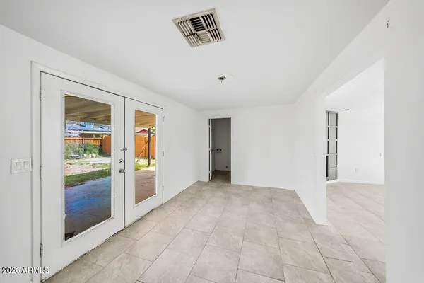 a view of an empty room with a window