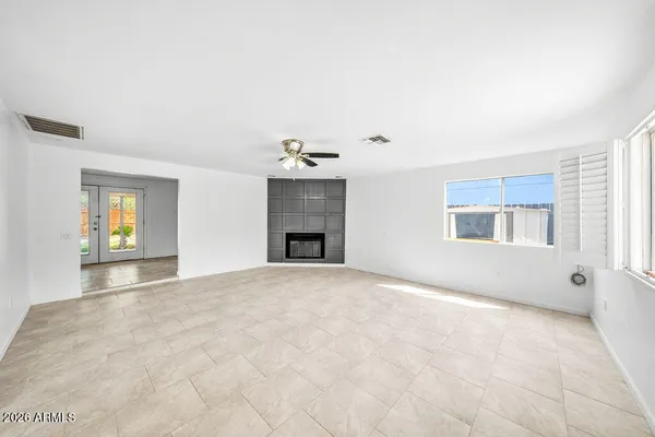 a view of an empty room with a window