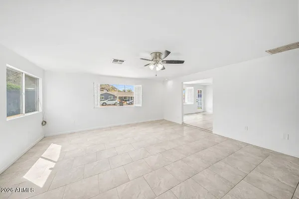 a view of an empty room with a window