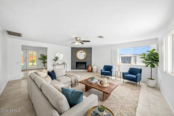 a living room with furniture and a large window