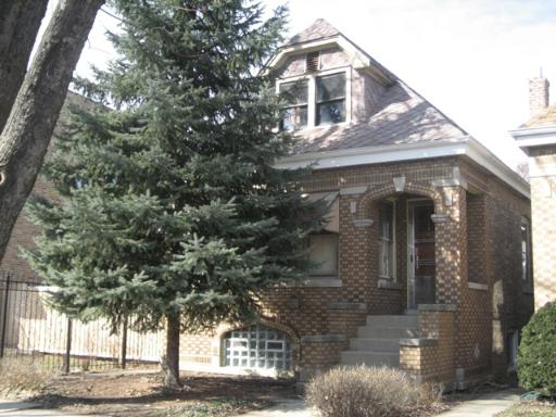 4326 West Henderson Street Chicago, IL 60641 - Photo 1 of 1 a front view of a house with trees