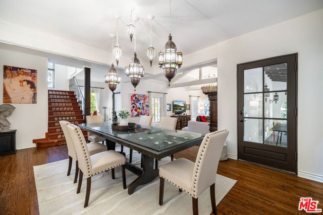 a kitchen with stainless steel appliances a refrigerator sink and microwave