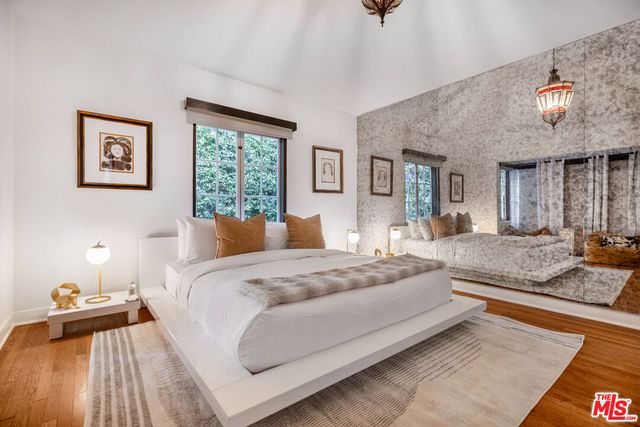 a bedroom with a bed and a couch