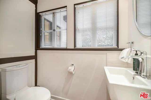 a view of a patio with table and chairs potted plants
