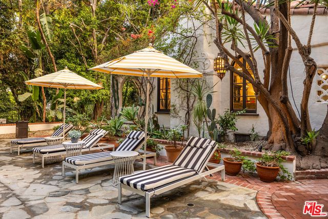 a view of a swimming pool with lounge chairs