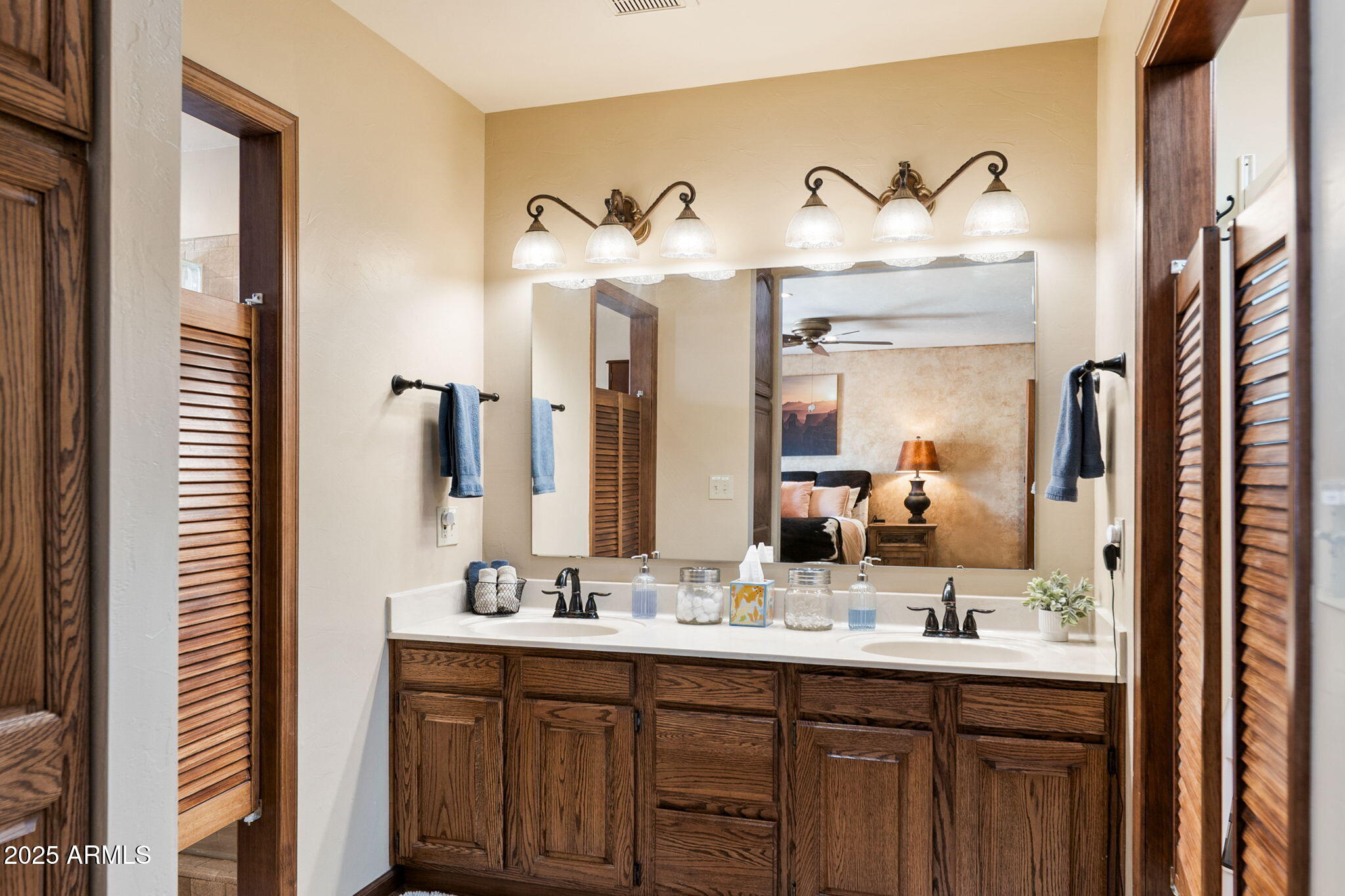 9972 East Del Monte Avenue Gold Canyon, AZ 85118 - Photo 13 of 49 a bathroom with a double vanity sink and a mirror
