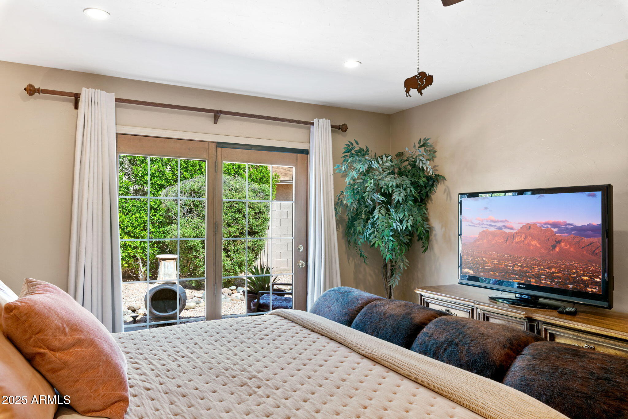 9972 East Del Monte Avenue Gold Canyon, AZ 85118 - Photo 16 of 49 a living room with furniture large window and a flat screen tv
