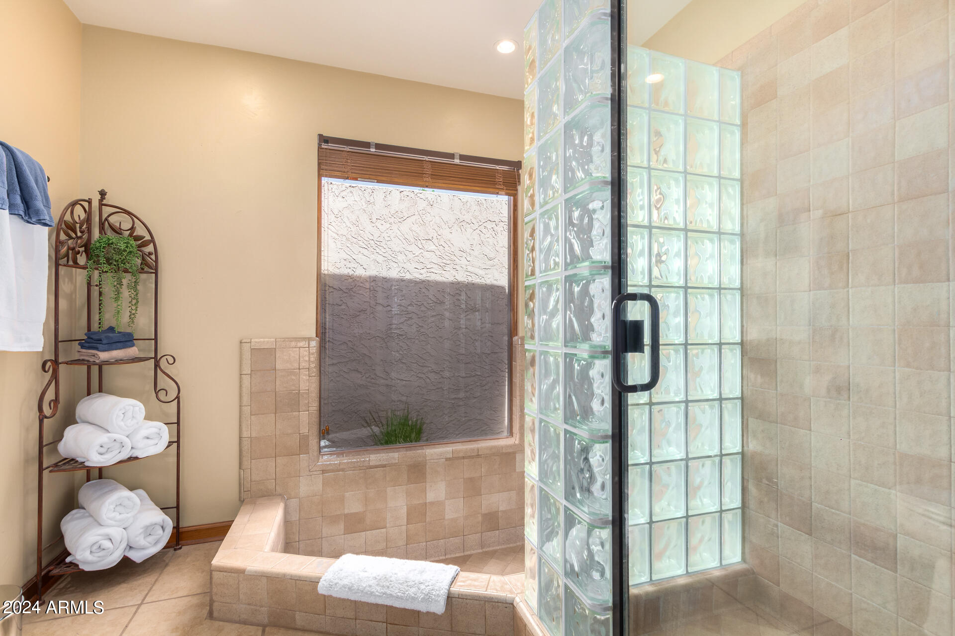 9972 East Del Monte Avenue Gold Canyon, AZ 85118 - Photo 19 of 49 a bathroom with a granite countertop shower a mirror and bathtub