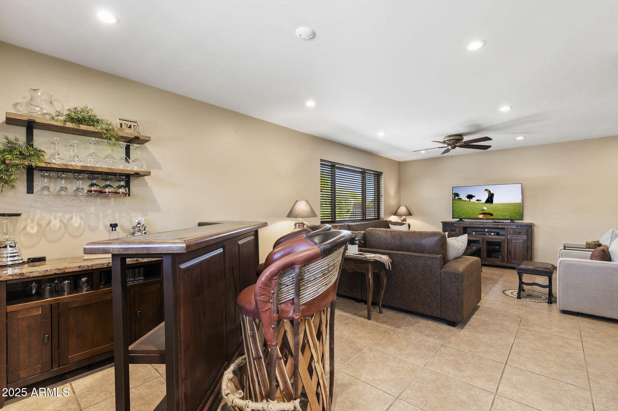 9972 East Del Monte Avenue Gold Canyon, AZ 85118 - Photo 27 of 49 a living room with furniture and a flat screen tv