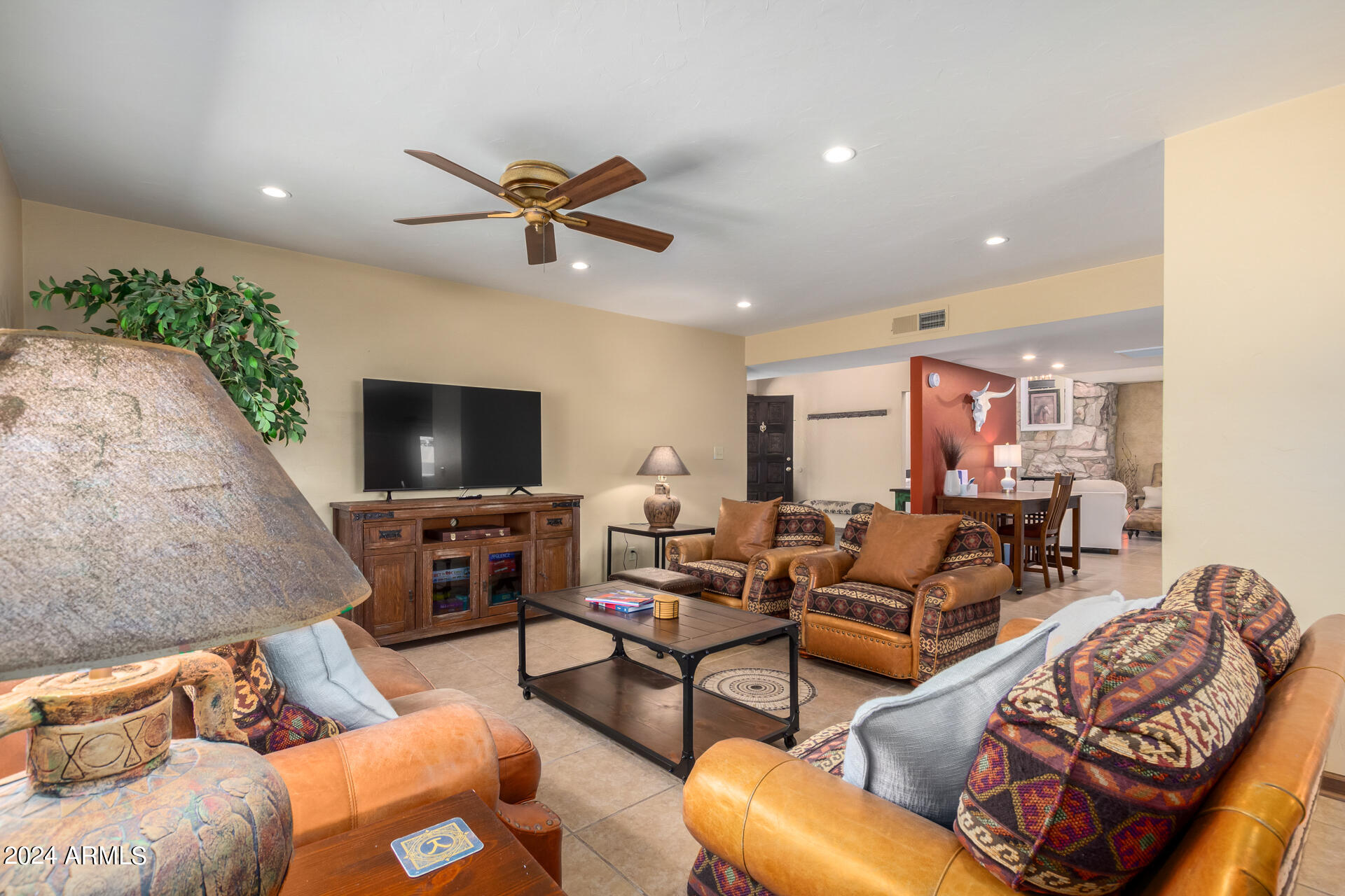 9972 East Del Monte Avenue Gold Canyon, AZ 85118 - Photo 3 of 49 a living room with furniture and a flat screen tv