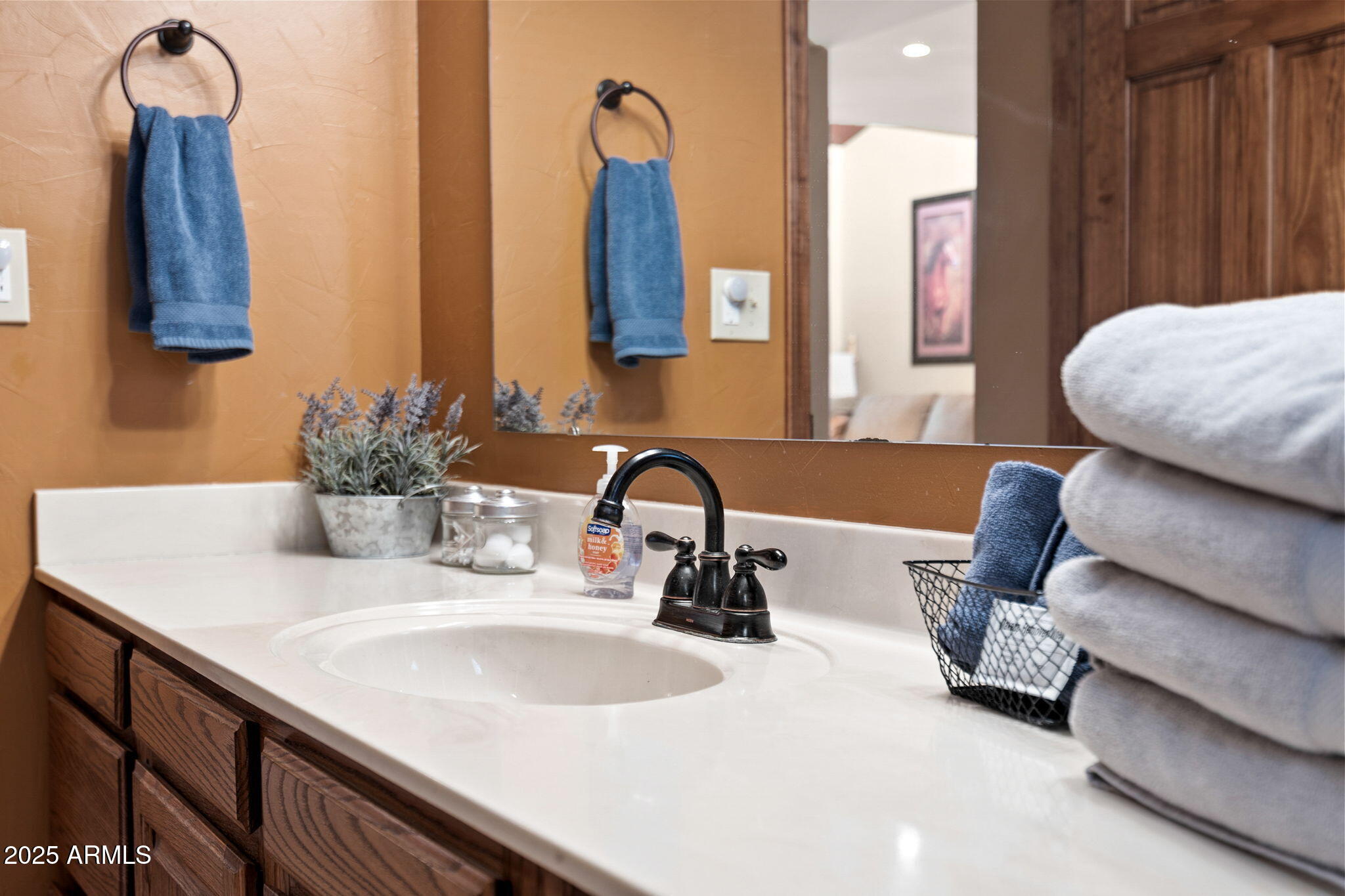 9972 East Del Monte Avenue Gold Canyon, AZ 85118 - Photo 37 of 49 a bathroom with a double vanity sink and mirror