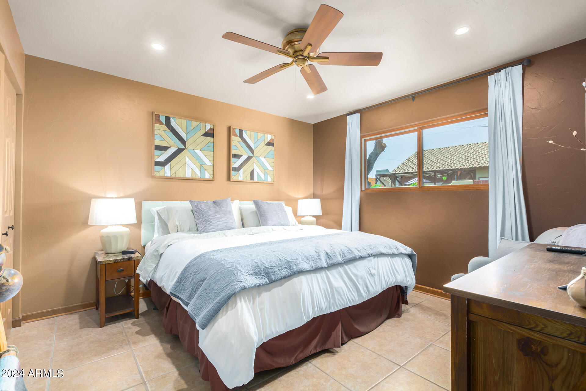 9972 East Del Monte Avenue Gold Canyon, AZ 85118 - Photo 38 of 49 a bedroom with a bed and a chandelier