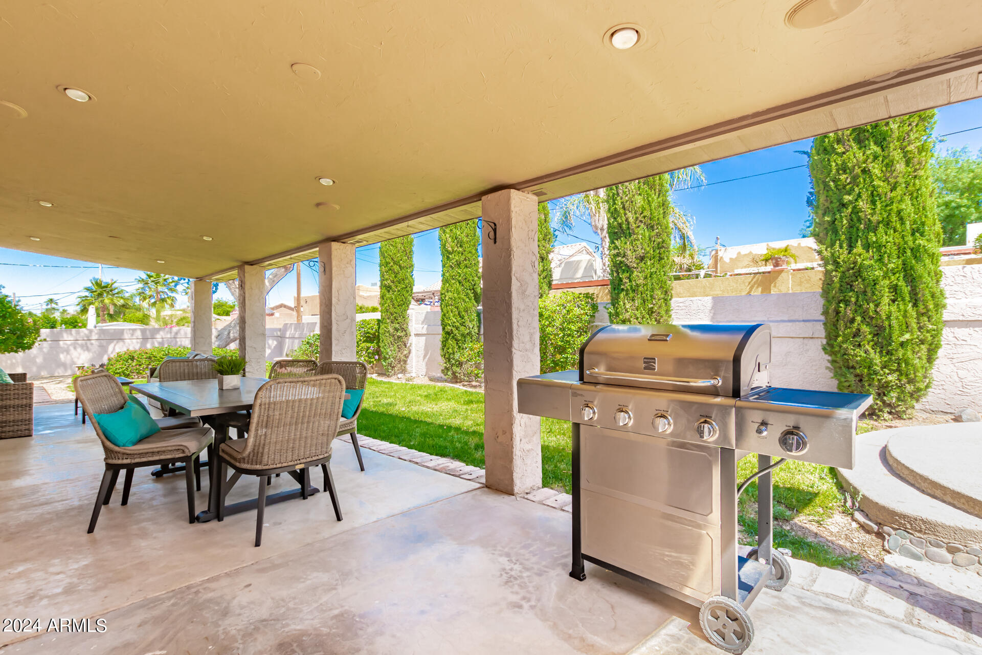 9972 East Del Monte Avenue Gold Canyon, AZ 85118 - Photo 48 of 49 a patio with yard glass top table and chairs