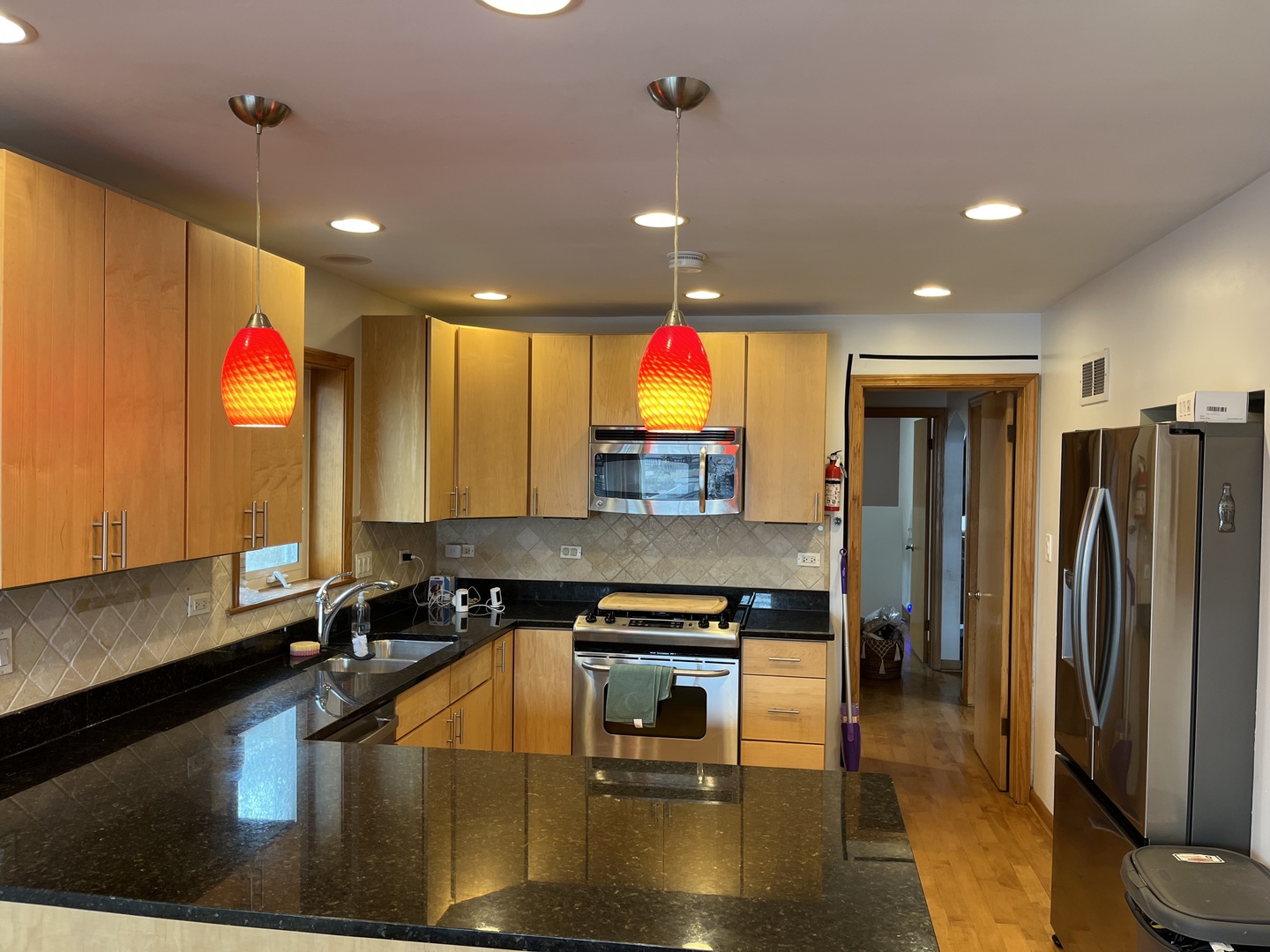 4505 West 55th Street Chicago, IL 60632 - Photo 12 of 15 a kitchen with stainless steel appliances granite countertop a sink and a refrigerator