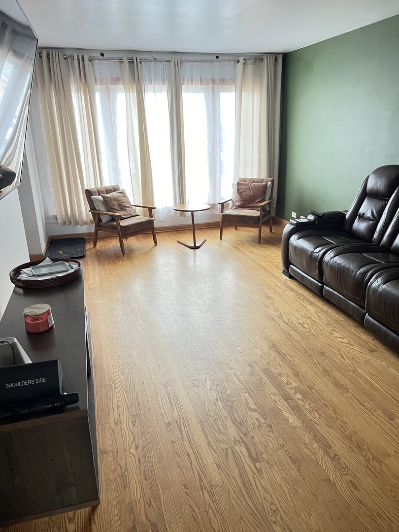 4505 West 55th Street Chicago, IL 60632 - Photo 3 of 15 a living room with furniture and a window