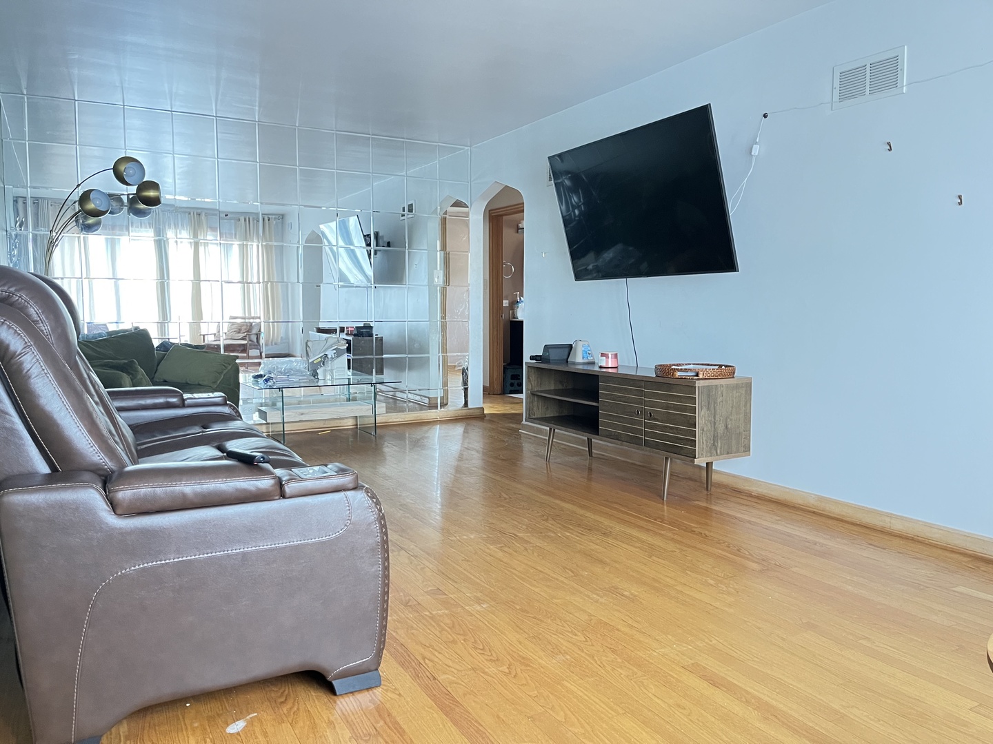 4505 West 55th Street Chicago, IL 60632 - Photo 5 of 15 a living room with furniture and a flat screen tv