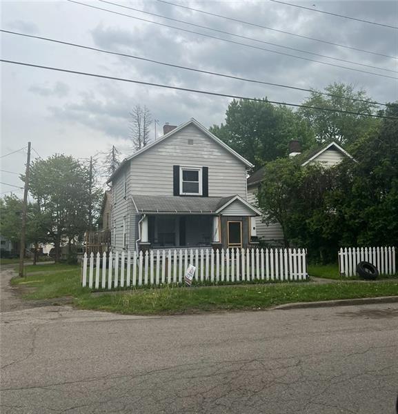 727 South State Line Road Sharon, PA 16146 - Photo 2 of 2 a view of a house with a small yard and fence