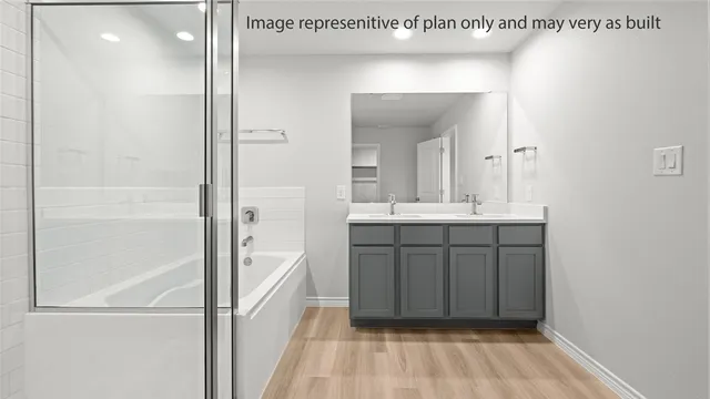 a bathroom with a sink a mirror and a shower