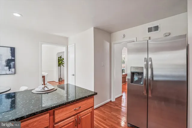 a view of a room with wooden floor and iron fence