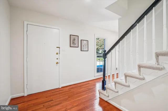 a living room with furniture fireplace and window