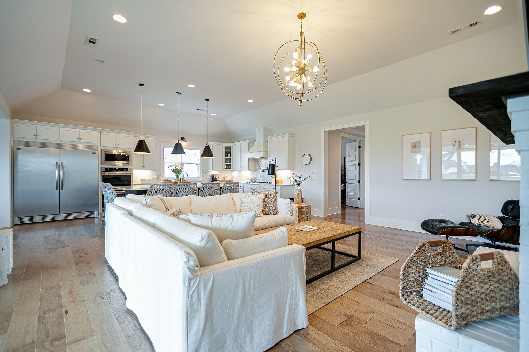 6563 Windmill Drive College Grove, TN 37046 - Photo 11 of 40 a living room with stainless steel appliances kitchen island granite countertop furniture a rug kitchen view and a chandelier