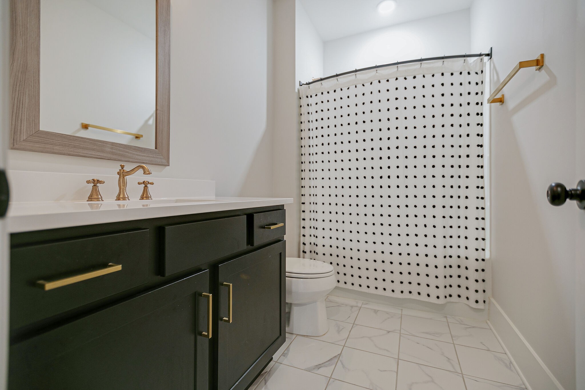 6563 Windmill Drive College Grove, TN 37046 - Photo 25 of 40 a bathroom with a sink a toilet and a shower