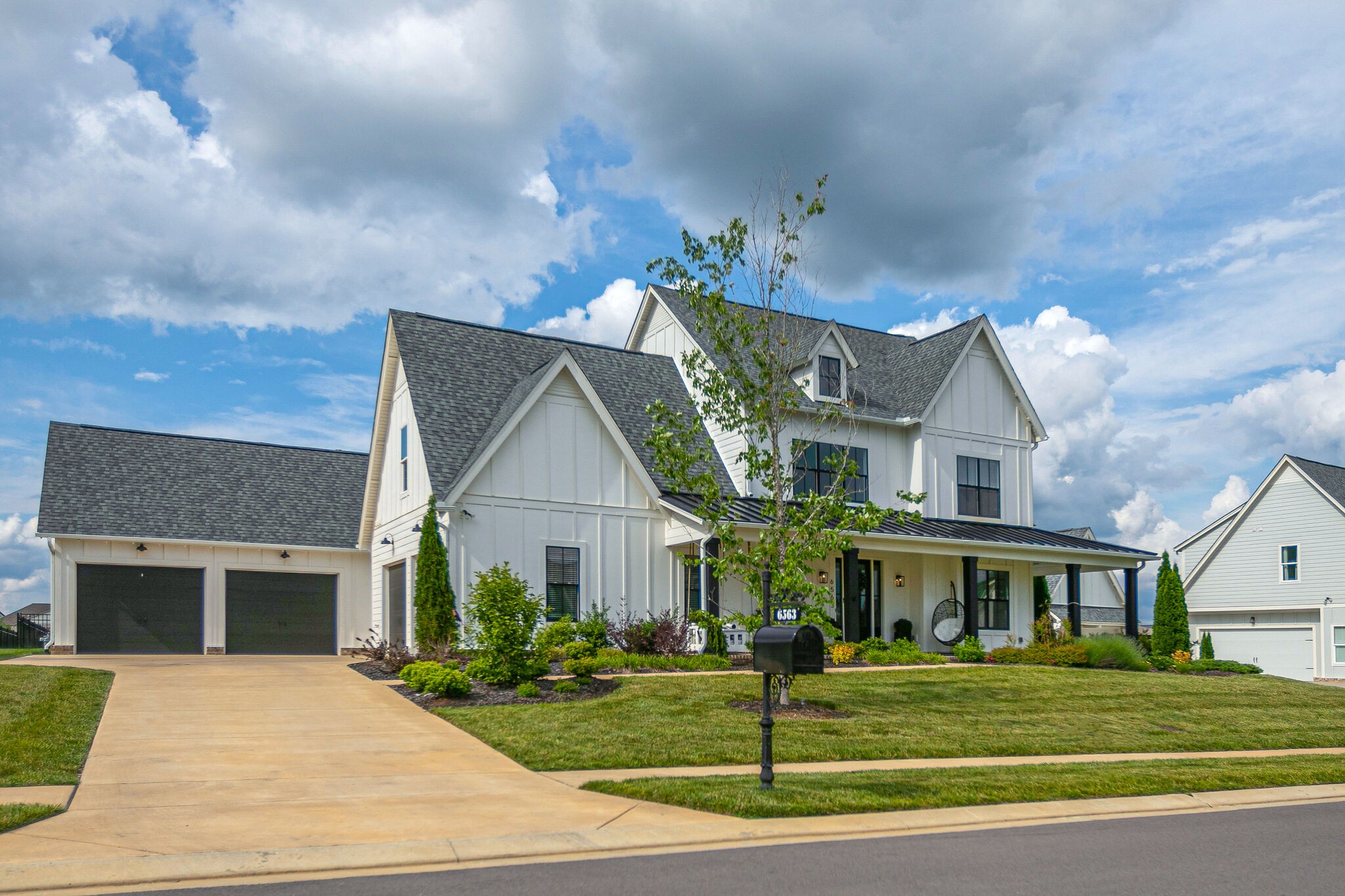 6563 Windmill Drive College Grove, TN 37046 - Photo 3 of 40 a front view of a house with a yard