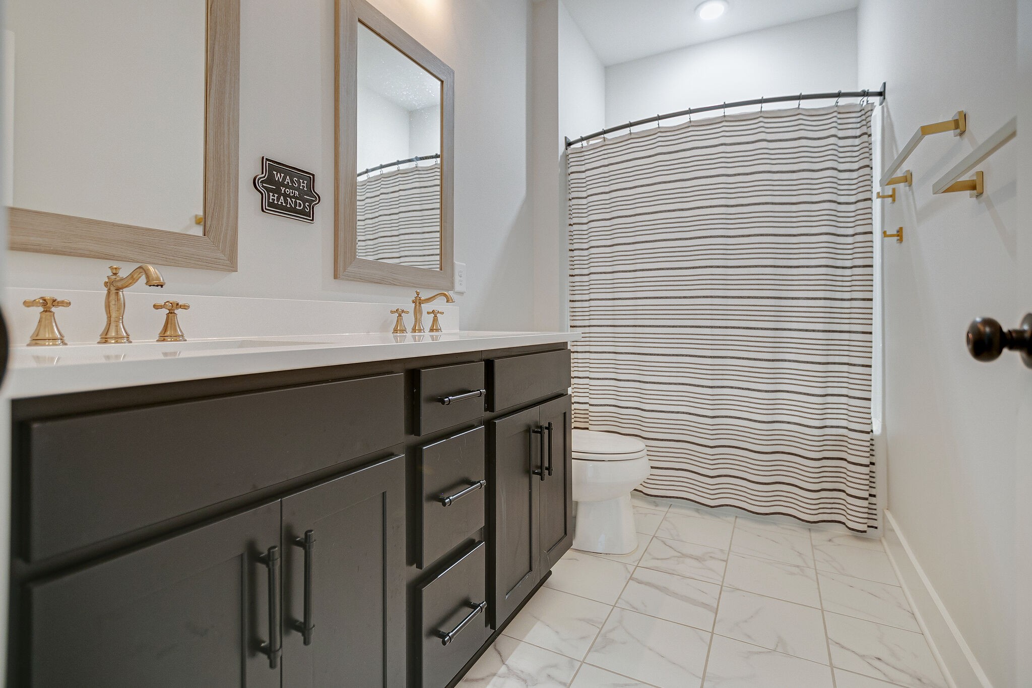 6563 Windmill Drive College Grove, TN 37046 - Photo 32 of 40 a bathroom with a sink a toilet and shower