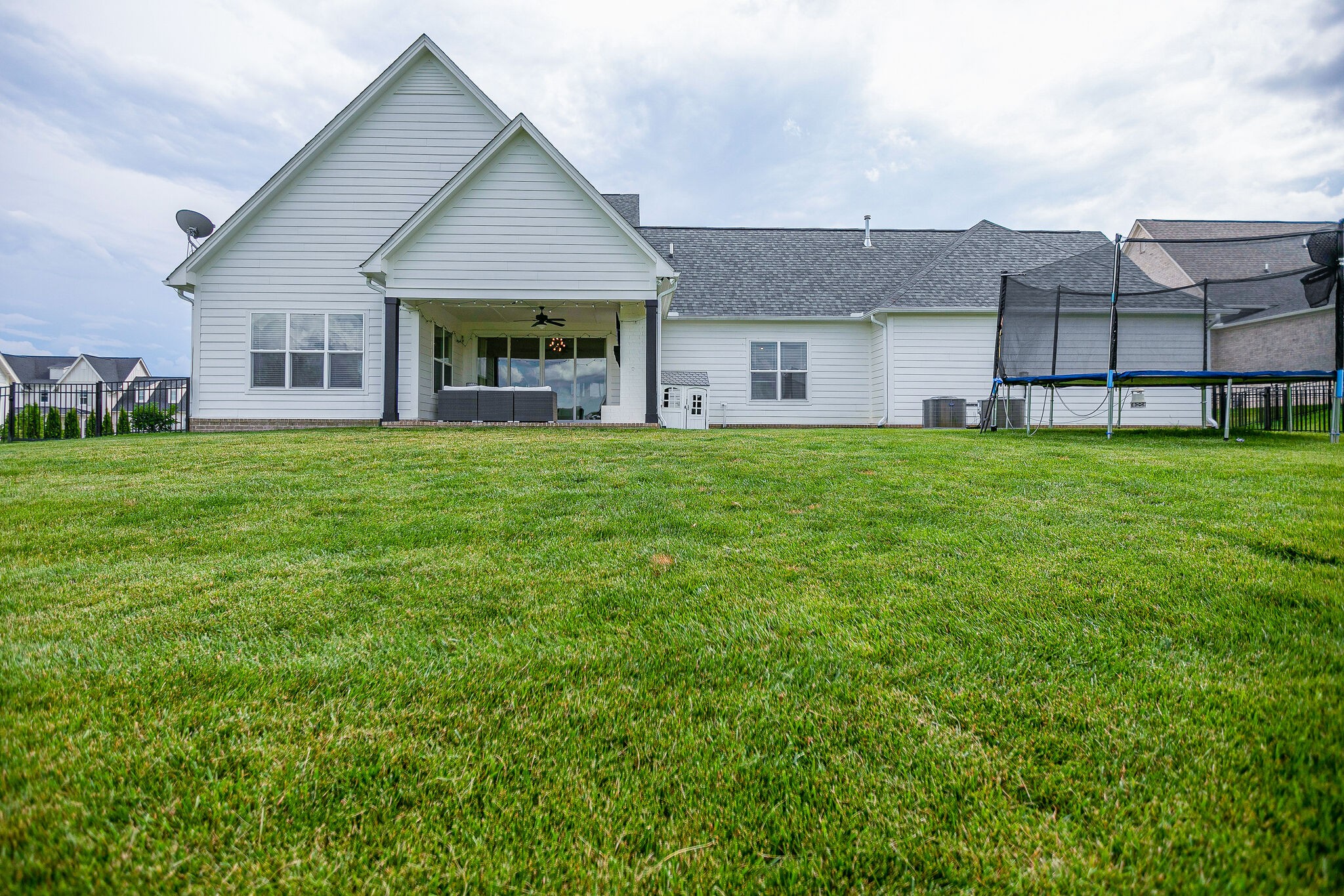 6563 Windmill Drive College Grove, TN 37046 - Photo 37 of 40 a front view of a house with a garden and yard