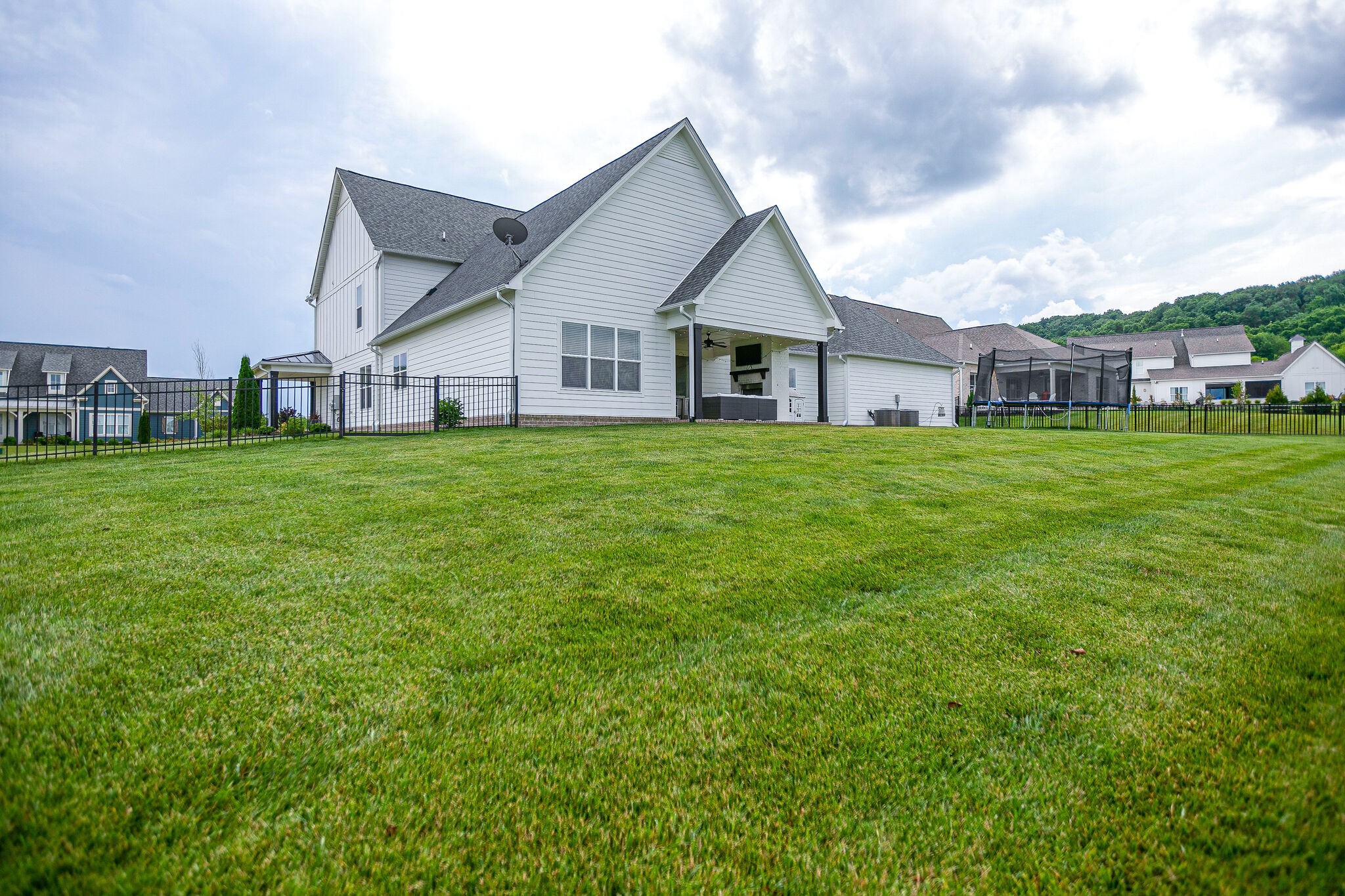 6563 Windmill Drive College Grove, TN 37046 - Photo 38 of 40 a front view of a house with a yard and trees