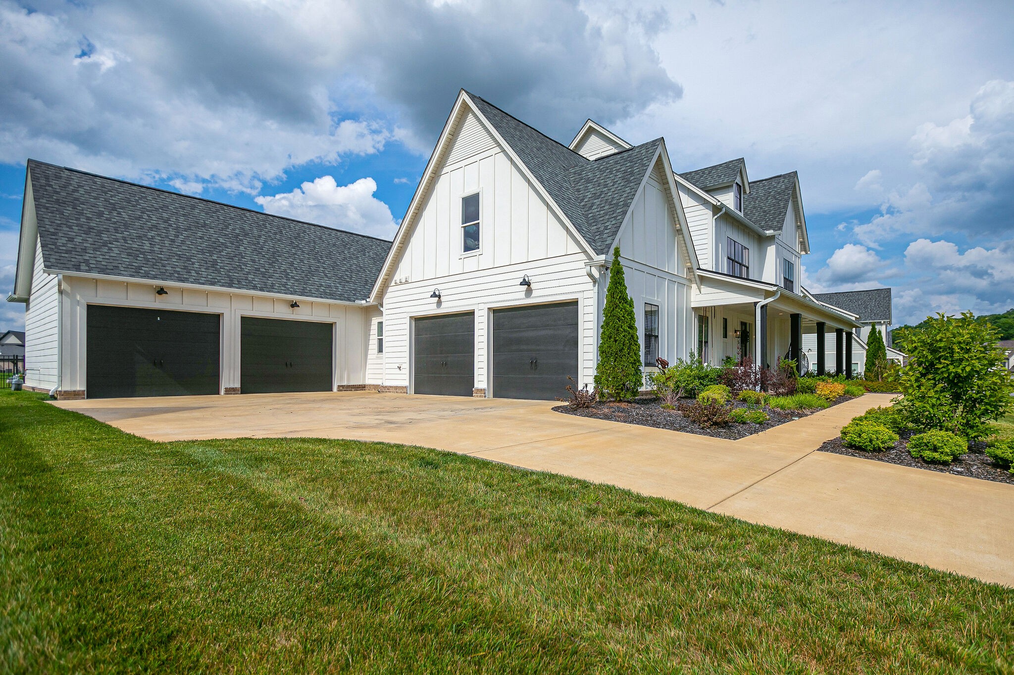 6563 Windmill Drive College Grove, TN 37046 - Photo 4 of 40 a front view of a house with a yard and garage