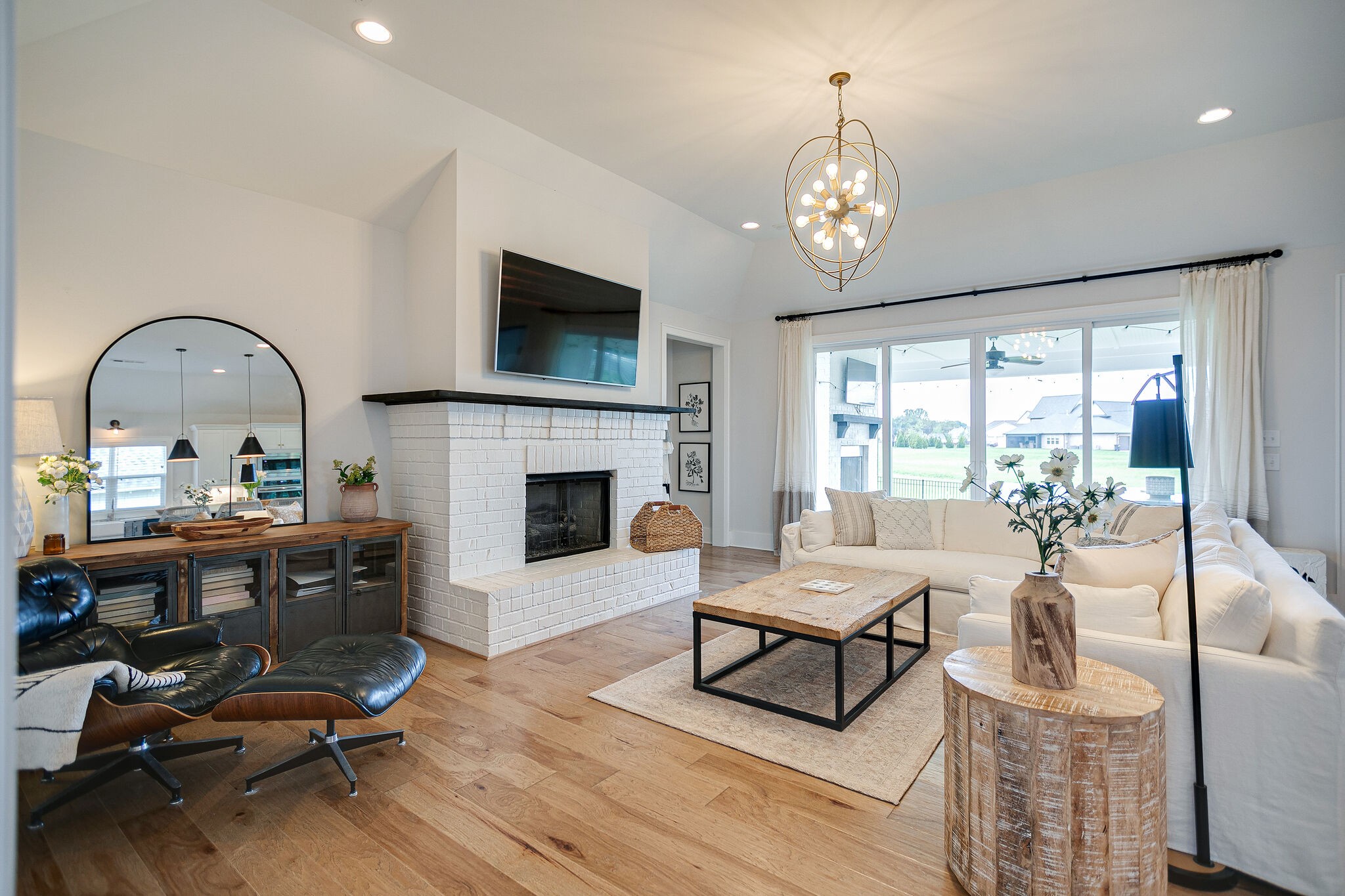 6563 Windmill Drive College Grove, TN 37046 - Photo 9 of 40 a living room with furniture a fireplace and a flat screen tv