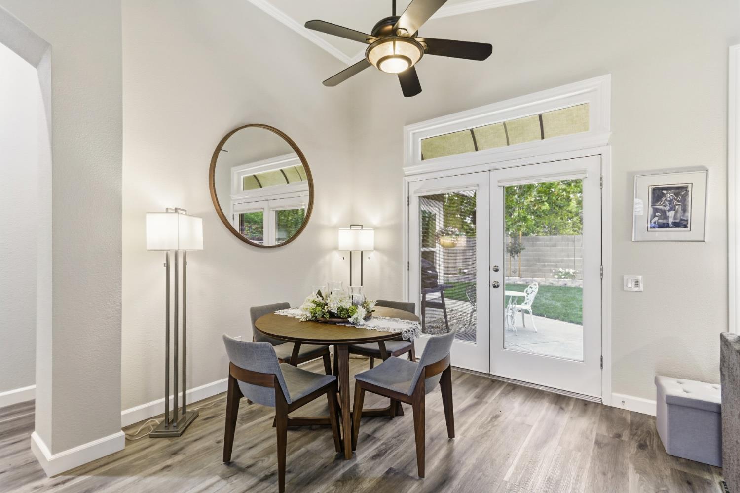5297 Angelrock Loop Roseville, CA 95747 - Photo 11 of 33 a view of a dining room with furniture window and wooden floor