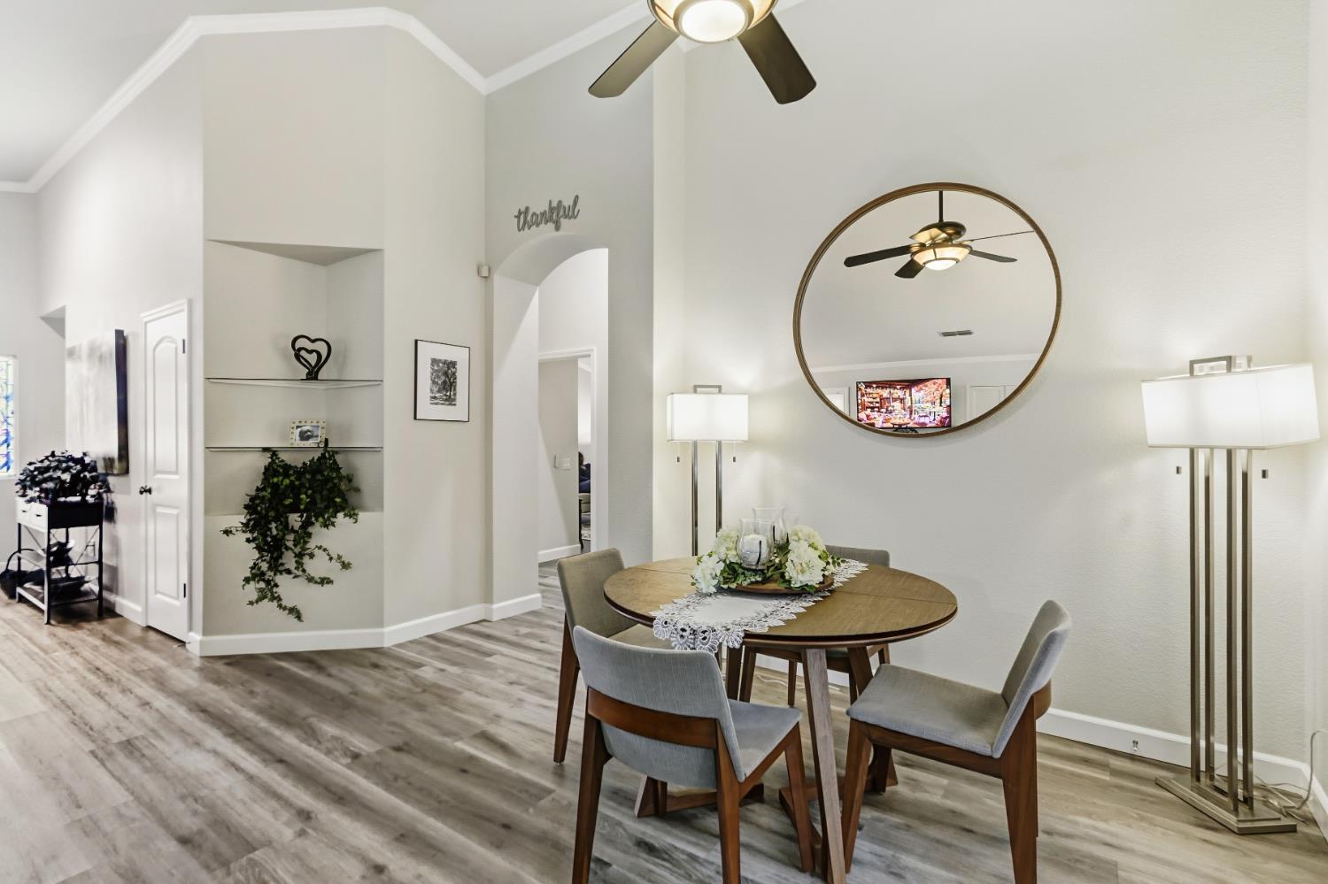 5297 Angelrock Loop Roseville, CA 95747 - Photo 12 of 33 a view of a dining room with furniture and a mirror