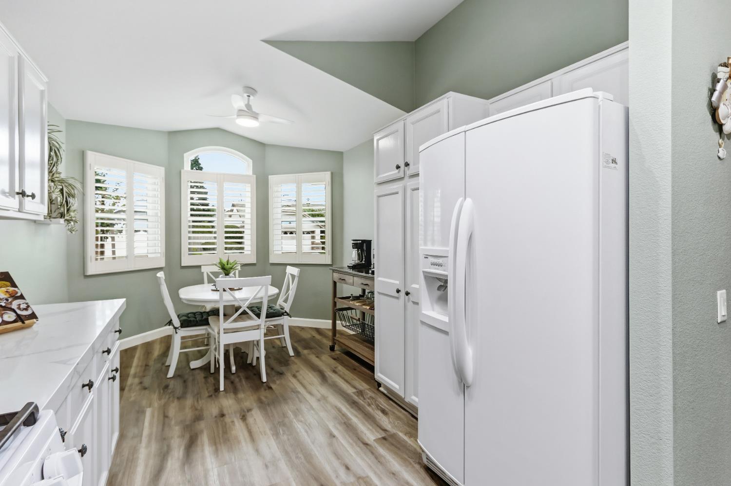 5297 Angelrock Loop Roseville, CA 95747 - Photo 16 of 33 a dining room with furniture and wooden floor