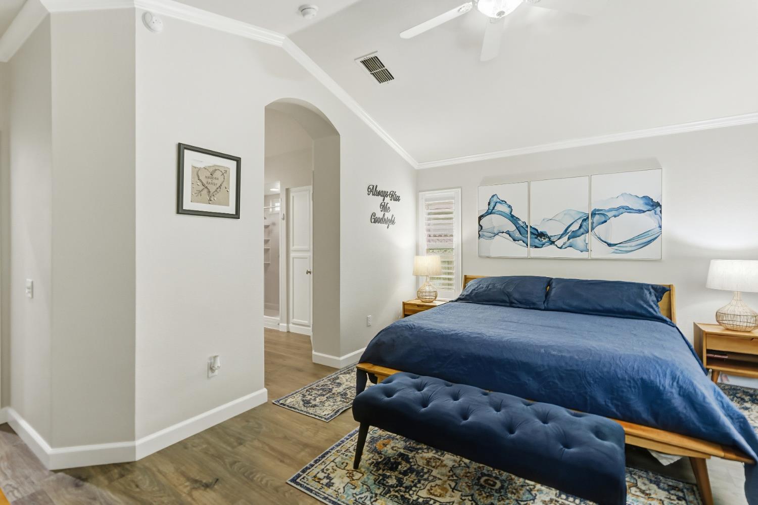 5297 Angelrock Loop Roseville, CA 95747 - Photo 19 of 33 a bedroom with a bed and wooden floor