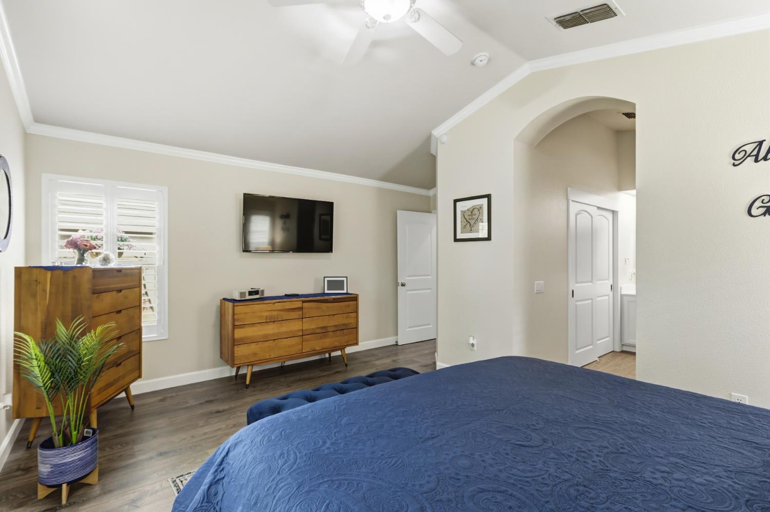 5297 Angelrock Loop Roseville, CA 95747 - Photo 20 of 33 a bedroom with a bed and a flat screen tv