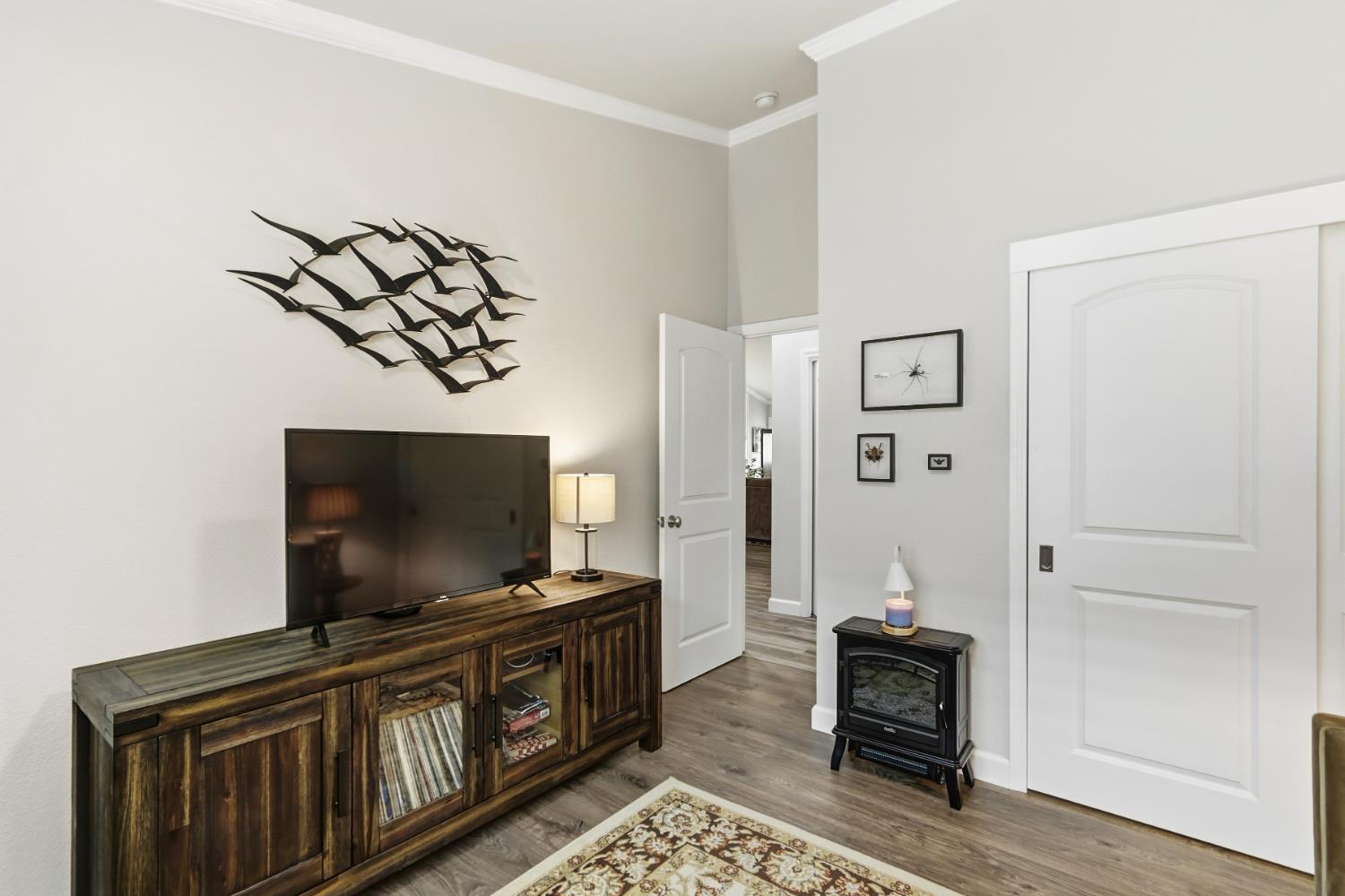 5297 Angelrock Loop Roseville, CA 95747 - Photo 26 of 33 a living room with furniture and a flat screen tv