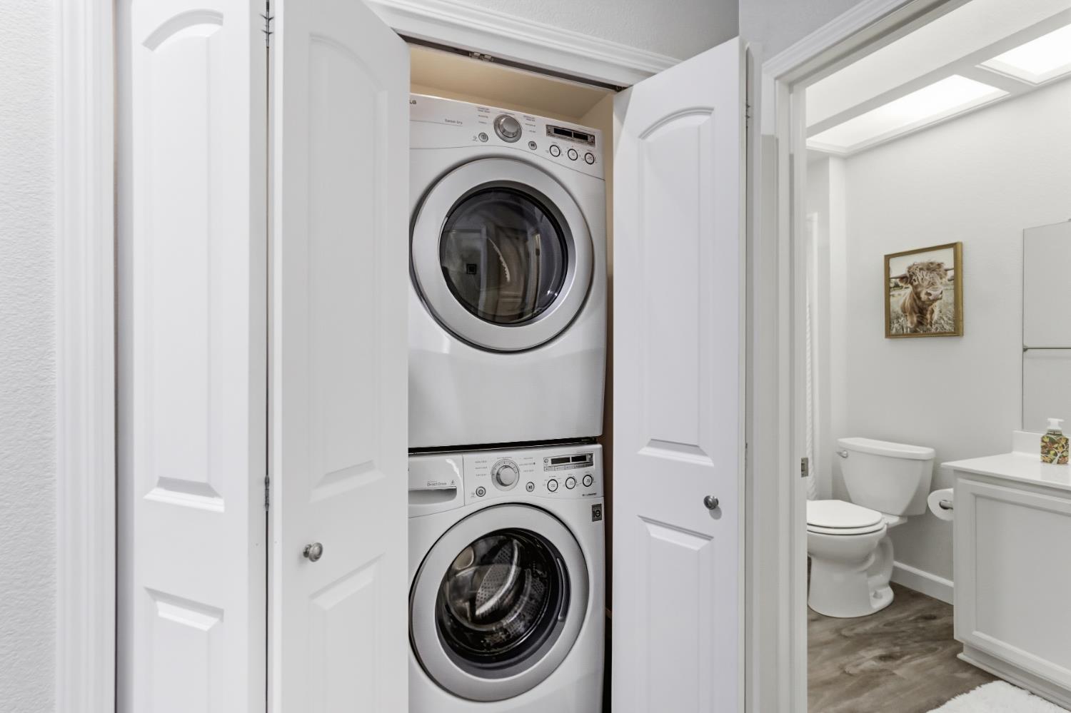 5297 Angelrock Loop Roseville, CA 95747 - Photo 28 of 33 a view of a hallway with washer and dryer