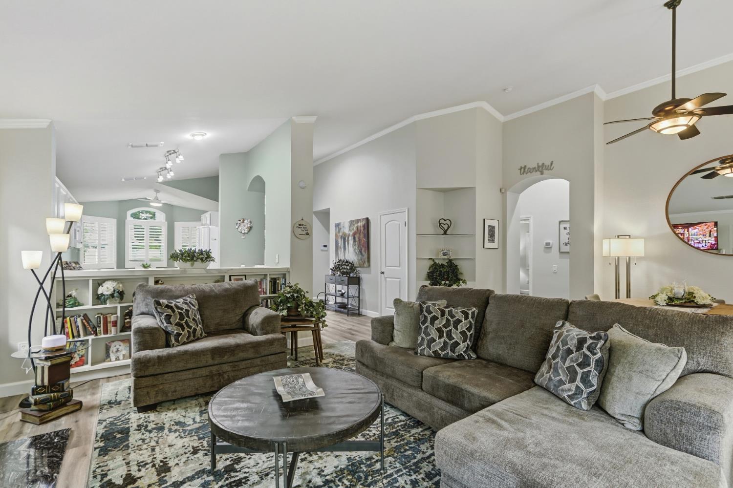 5297 Angelrock Loop Roseville, CA 95747 - Photo 5 of 33 a living room with furniture kitchen view and a chandelier