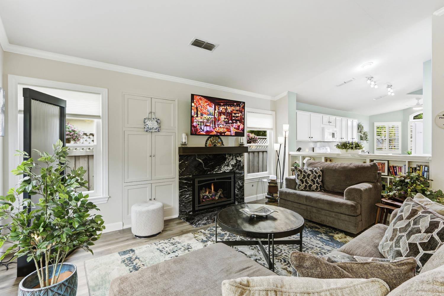 5297 Angelrock Loop Roseville, CA 95747 - Photo 7 of 33 a living room with furniture and a fireplace