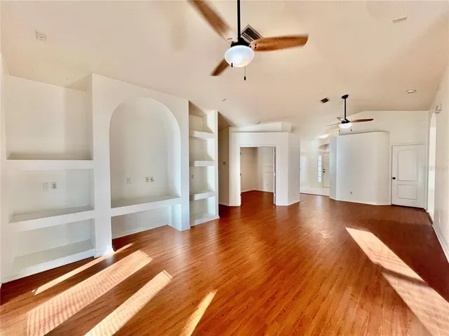 a view of a livingroom with wooden floor