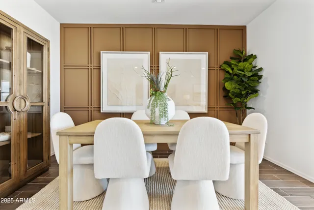 a view of a dining room with furniture and a table