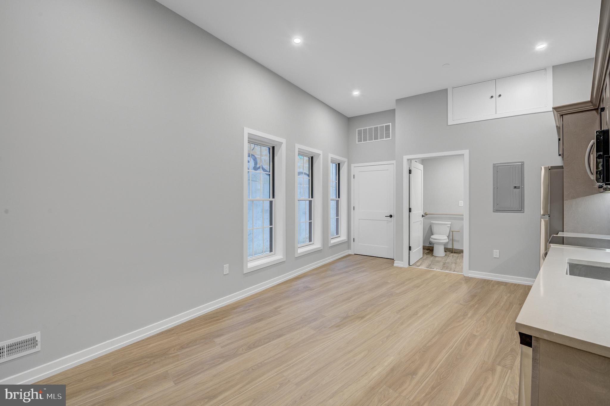 2445 Innovator Way, Unit 1A Philadelphia, PA 19146 - Photo 3 of 14 a view of empty room with wooden floor