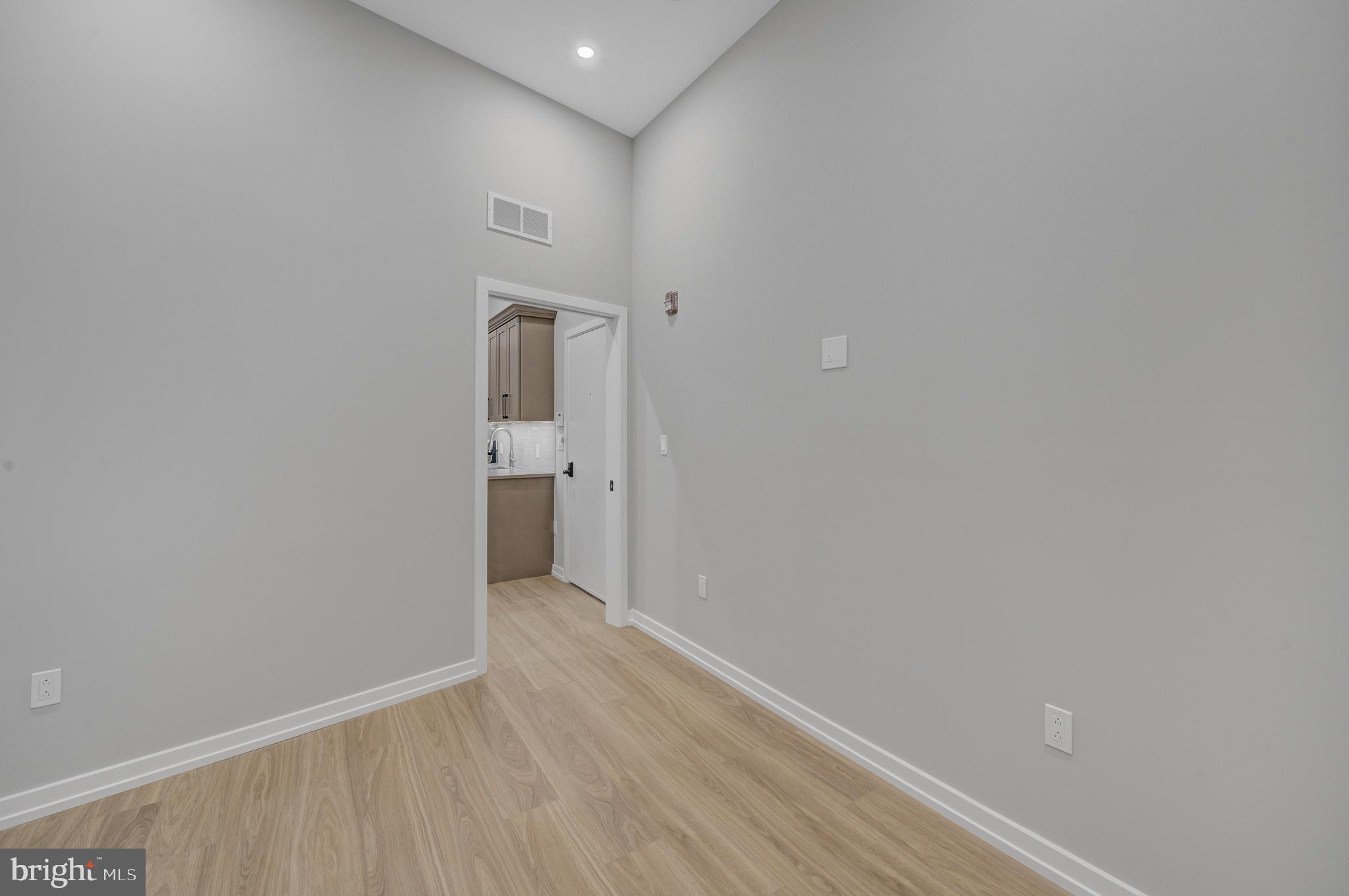2445 Innovator Way, Unit 1A Philadelphia, PA 19146 - Photo 10 of 14 a view of a hallway with wooden floor
