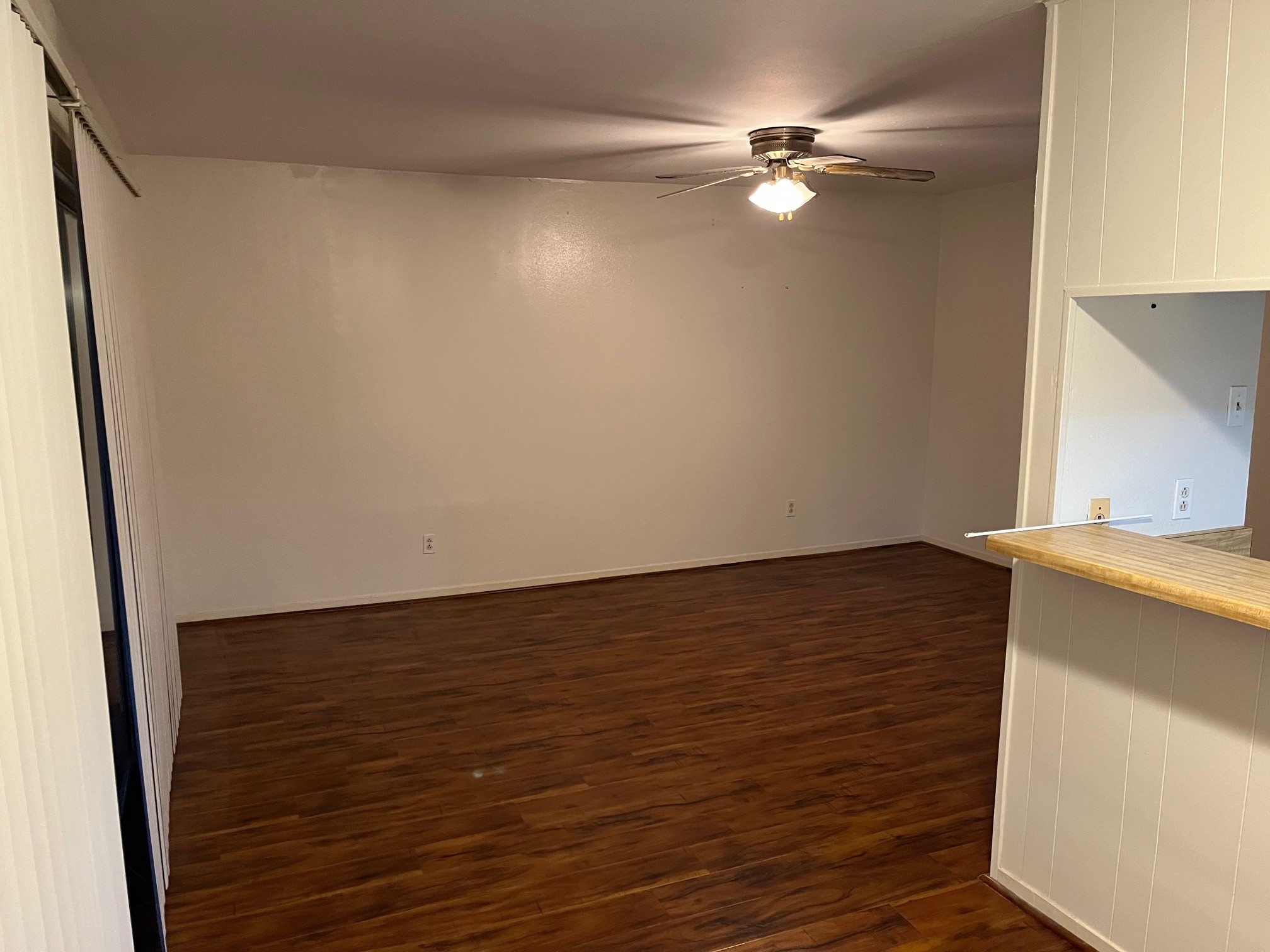 3938 West Alabama Street, Unit 12 Houston, TX 77027 - Photo 7 of 25 Additional view of the living area showcasing open layout & wood-look flooring throughout.
